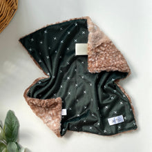 Load image into Gallery viewer, A green and brown minky lovey blanket with a silky soft satin ribbon on the upper right corner, displayed on a flat surface.